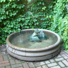 Small fountain in a landscaped garden